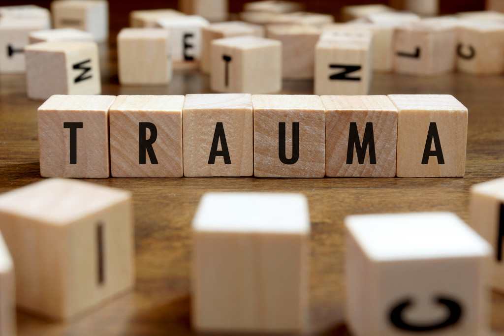 the word trauma spelled out in wooden blocks