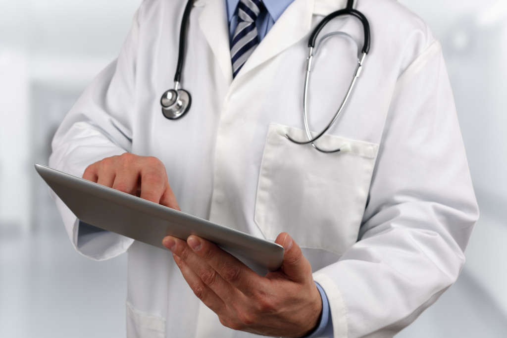 doctor holding a tablet